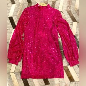 Aakaa got pink sequin minidress. High neck. Matching belt.